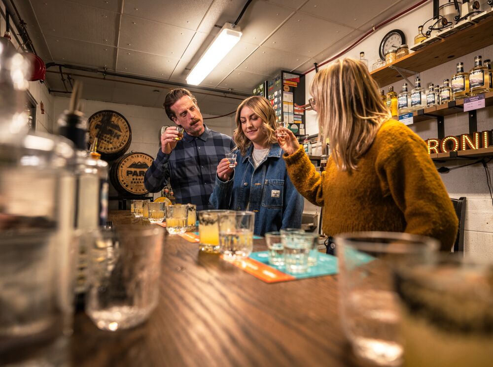 Three people trying gin during the Blend your Own Gin experience at PARK Distillery.